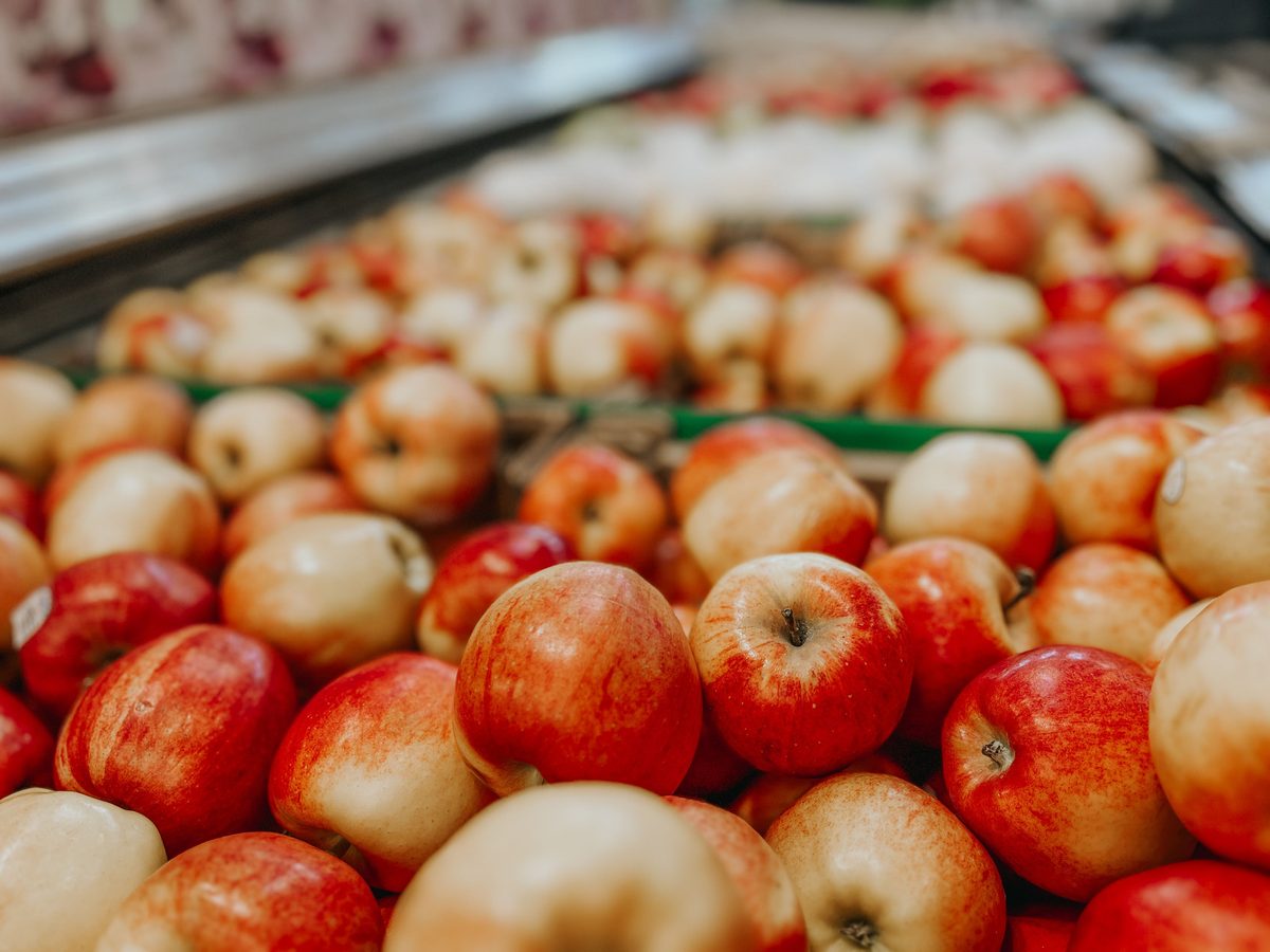 Mixed seasonal fruit packed in a wooden crate